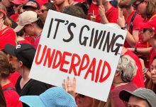 A Victorian teacher holds up a sign that says ‘It's giving underpaid’ at a strike on Thursday. Picture: Facebook.